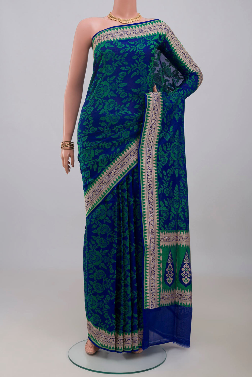 Blue Banarasi Silk Saree with Thread Butta on the body and Zari Border.  displayed on a mannequin