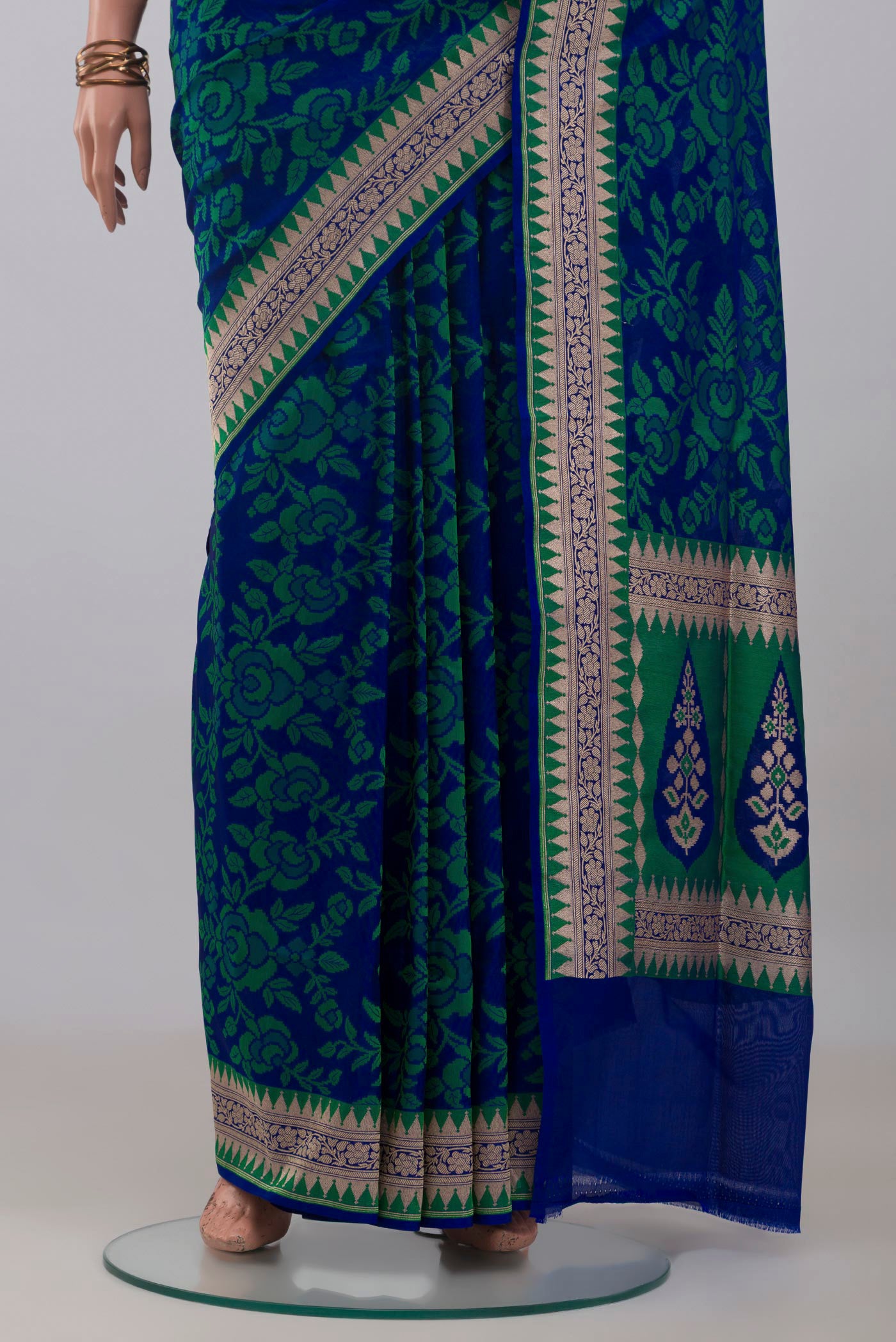 Pleats and pallu of Blue Banarasi Silk Saree with Thread Butta on the body and Zari Border. 