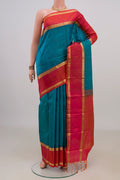 Pure Silk Blue Kanjivaram Saree with Zari Butta on the body and Zari Border.  displayed on a mannequin