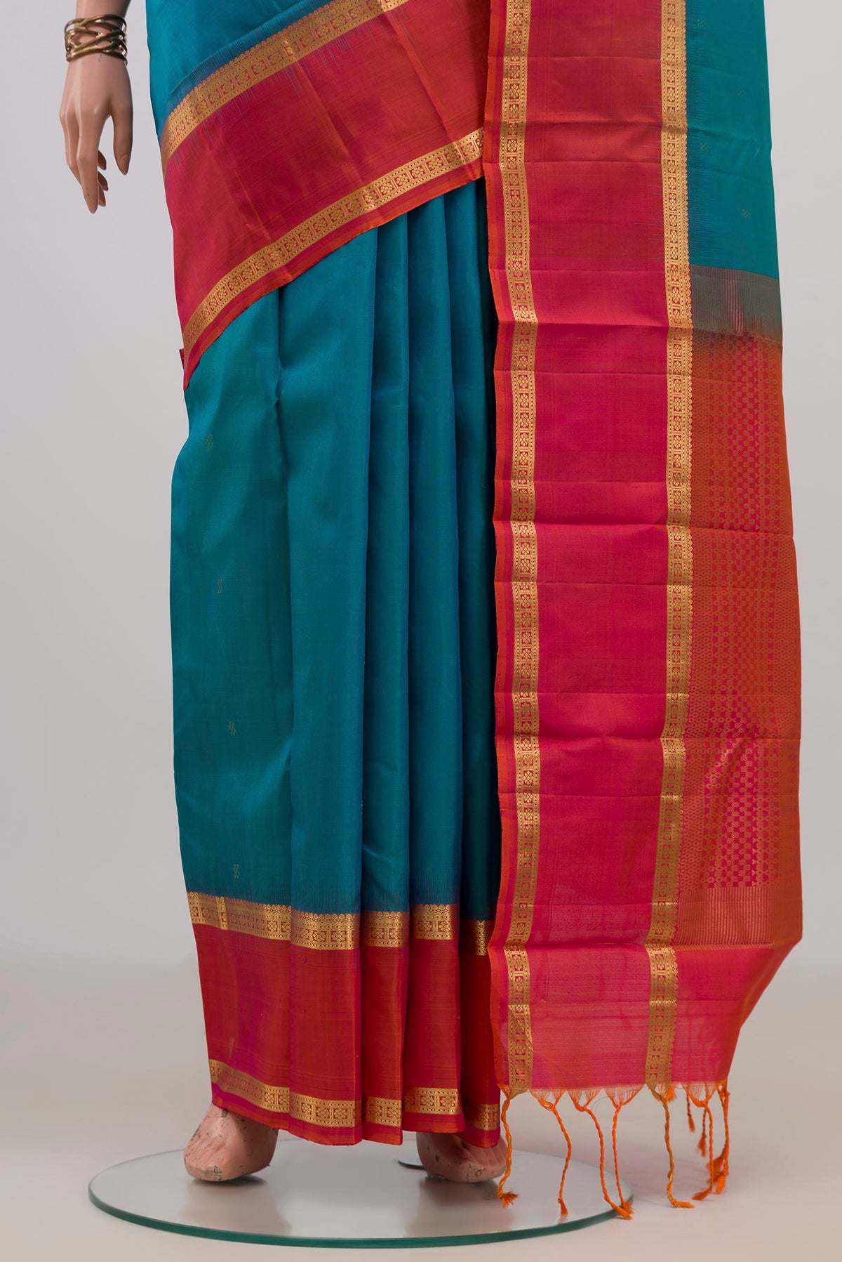 Pleats and pallu of Pure Silk Blue Kanjivaram Saree with Zari Butta on the body and Zari Border. 
