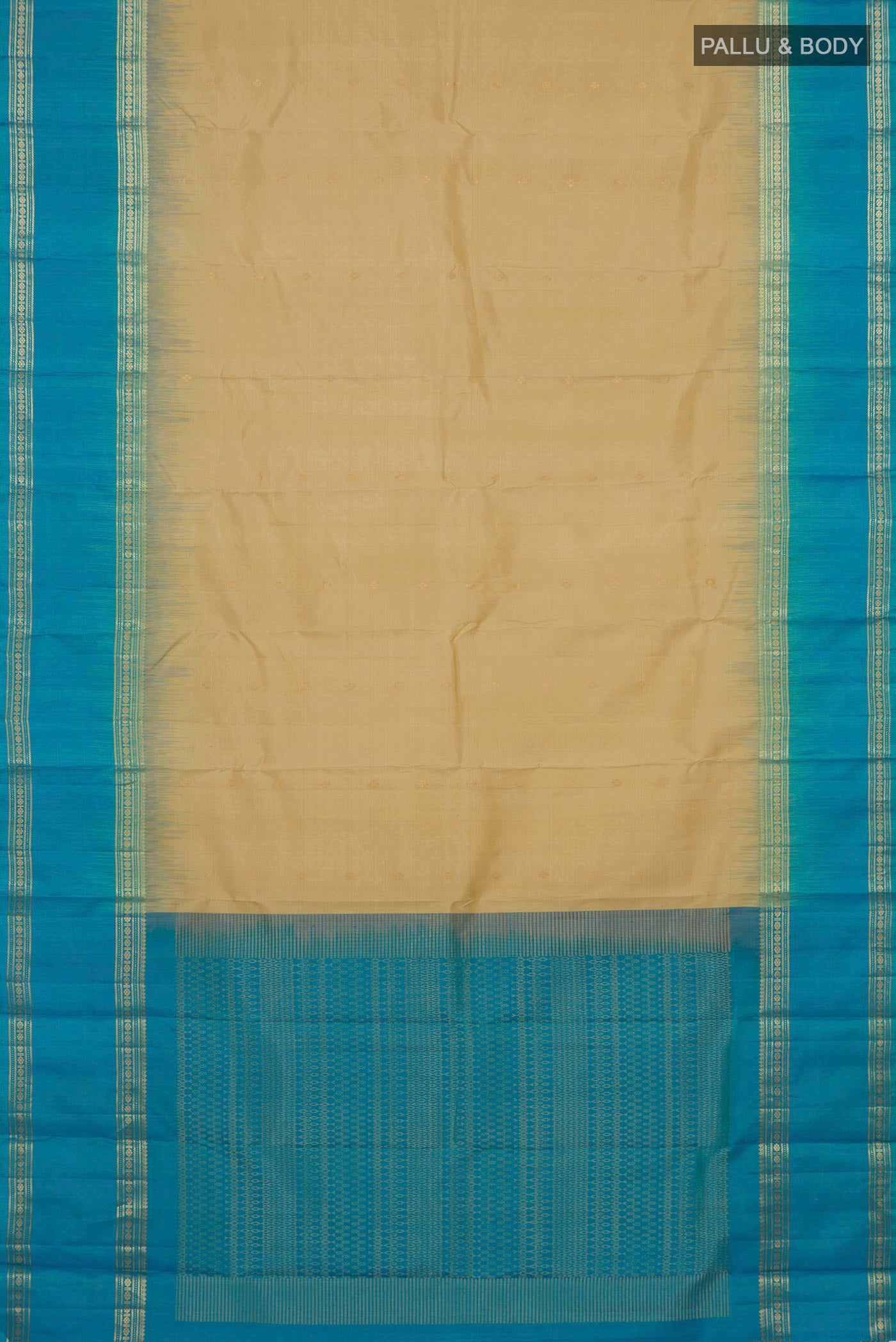Flat view of Beige Soft Silk Saree with Zari Butta on the body and Zari Border. 