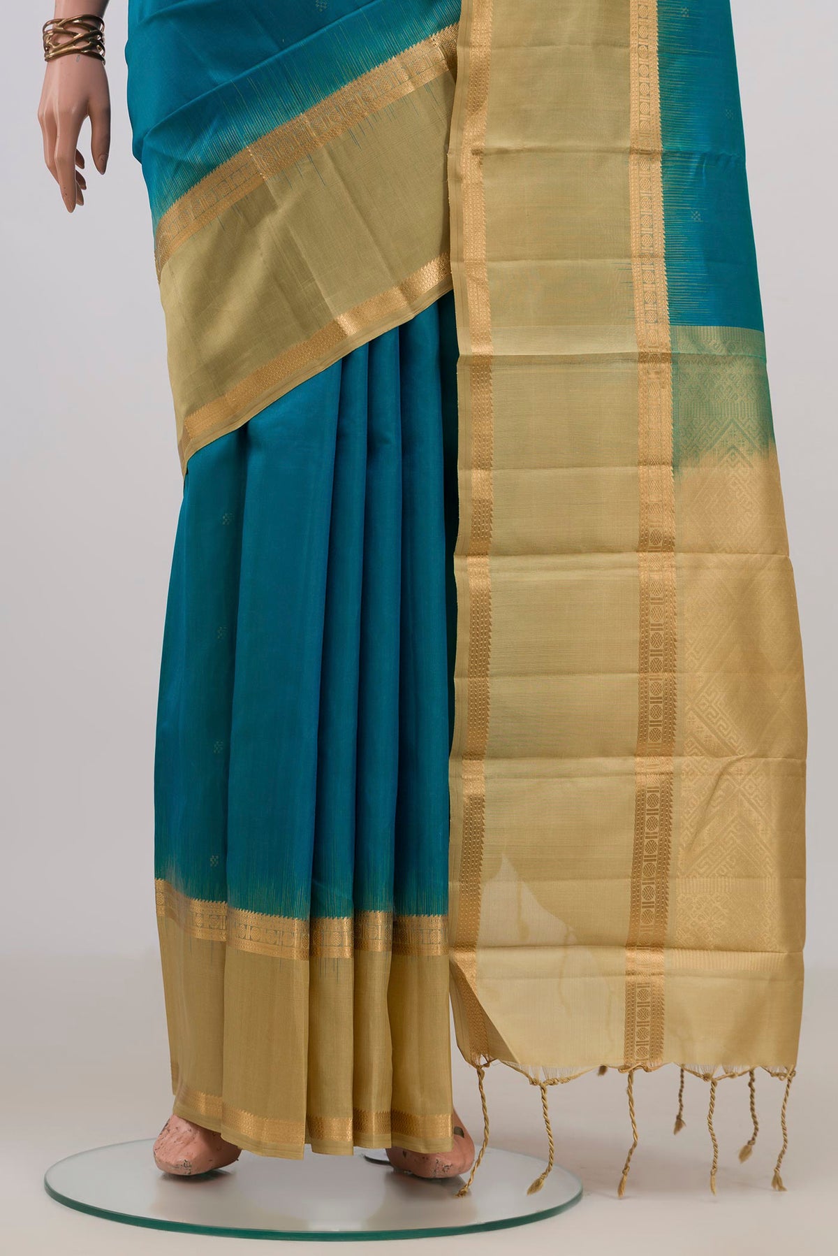 Pleats and pallu of Pure Silk Blue Kanjivaram Saree with Zari Butta on the body and Zari Border. 