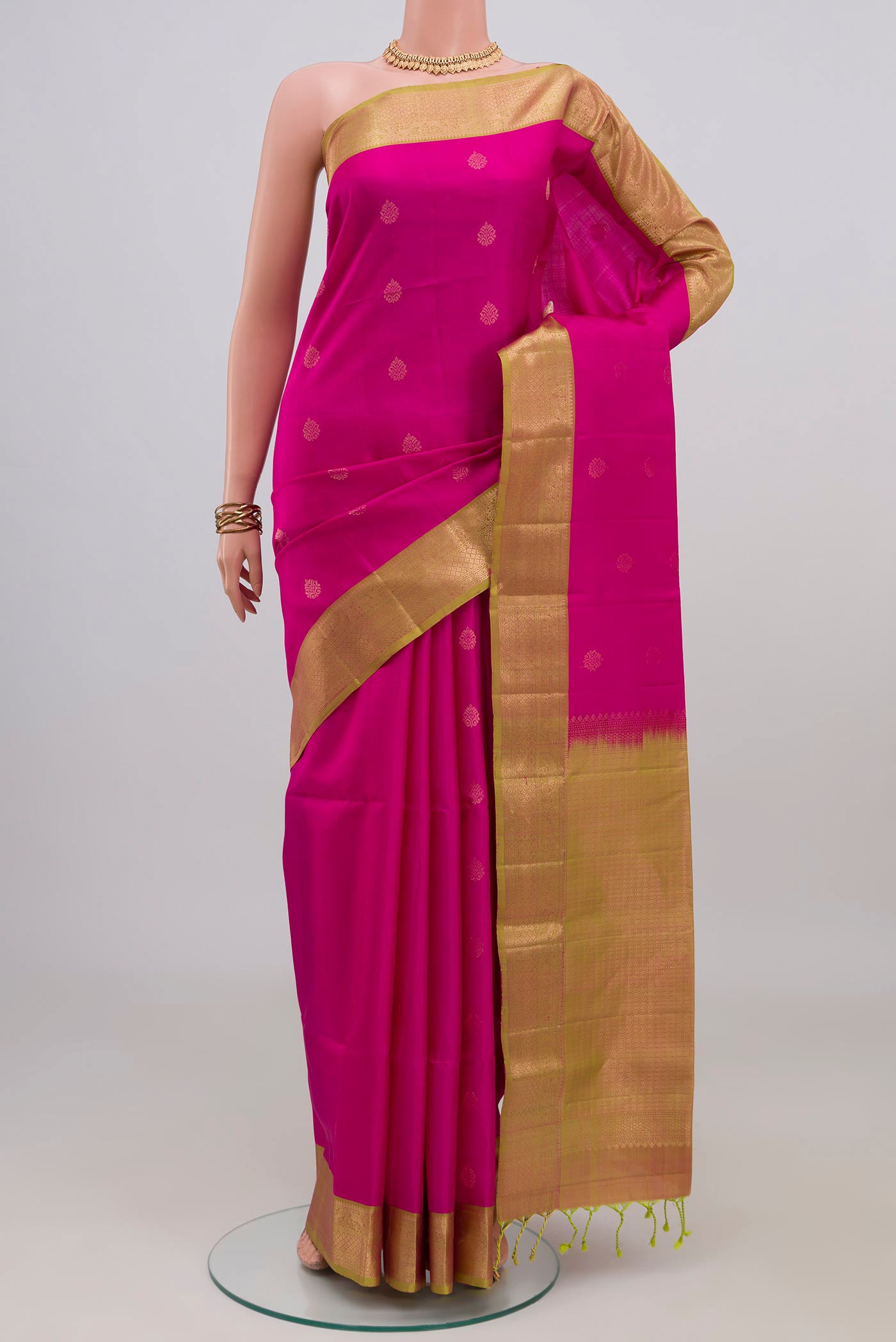 Pink Soft Silk Saree with Zari Butta on the body and Zari Border.  displayed on a mannequin