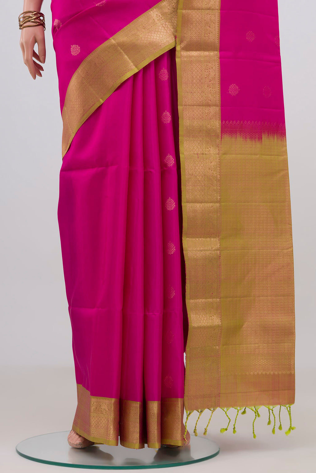 Pleats and pallu of Pink Soft Silk Saree with Zari Butta on the body and Zari Border. 