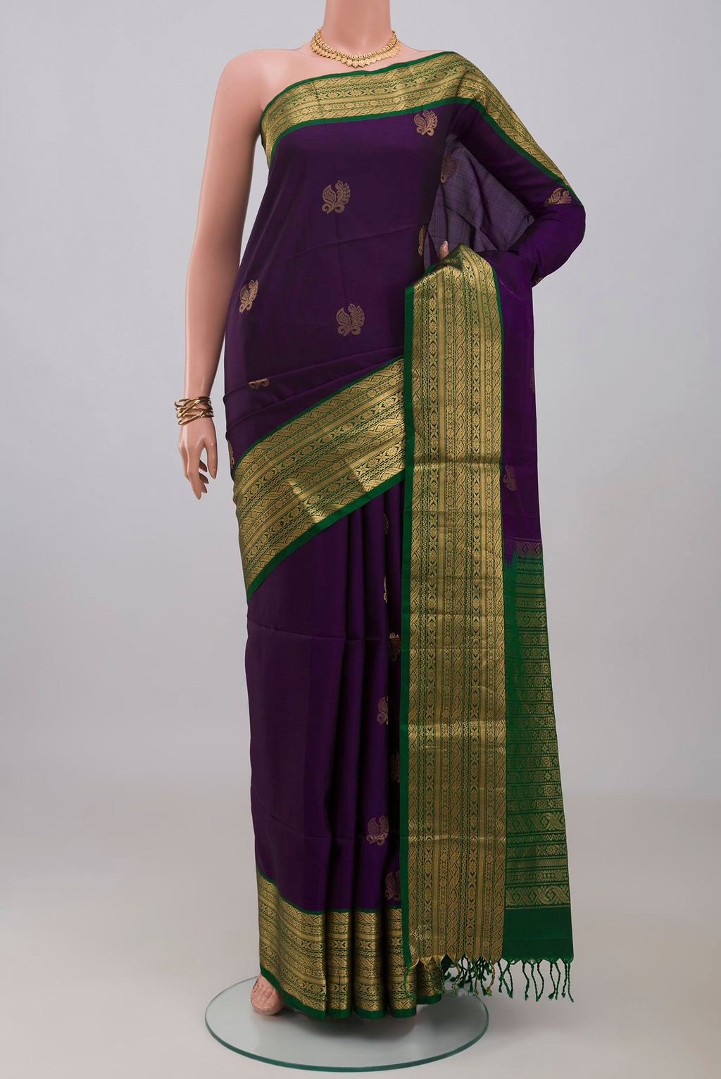 Violet Soft Silk Saree with Zari Butta on the body and Zari Border.  displayed on a mannequin