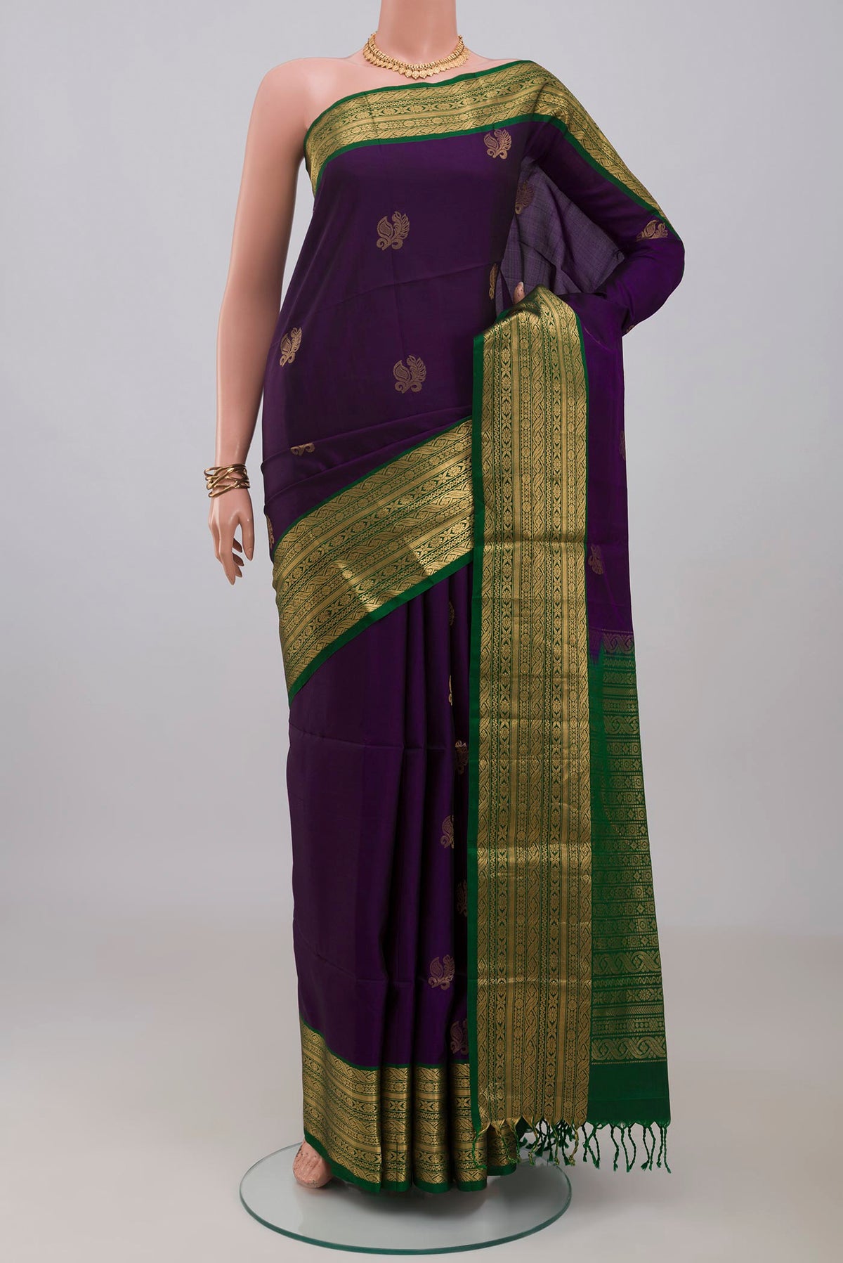 Violet Soft Silk Saree with Zari Butta on the body and Zari Border.  displayed on a mannequin