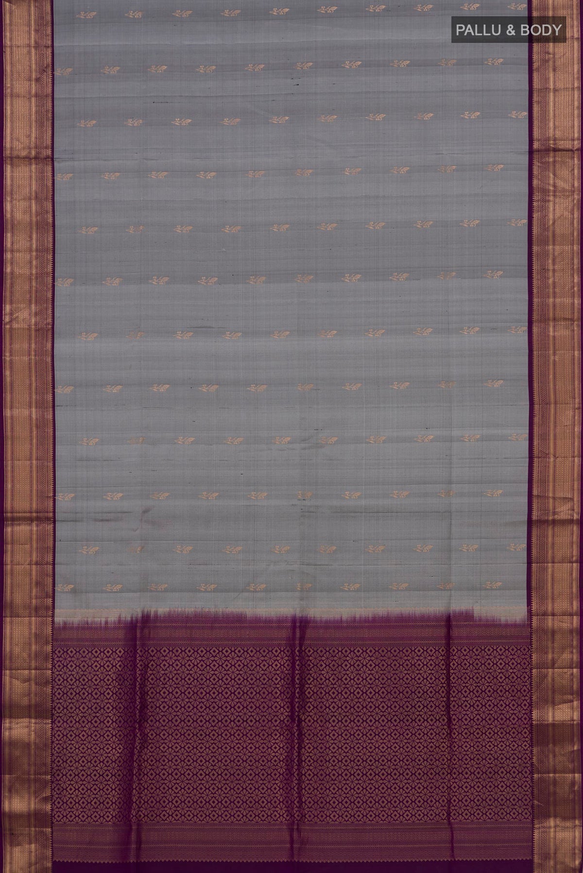 Flat view of Pure Silk Grey Soft Saree with Zari Butta on the body and Zari Border. 