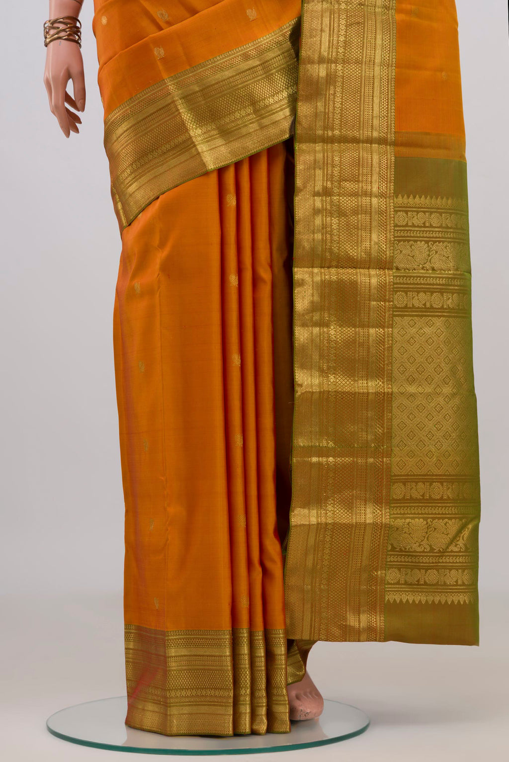 Pleats and pallu of Pure Silk Yellow Kanchipuram Saree with Zari Butta on the body and Zari Border. 