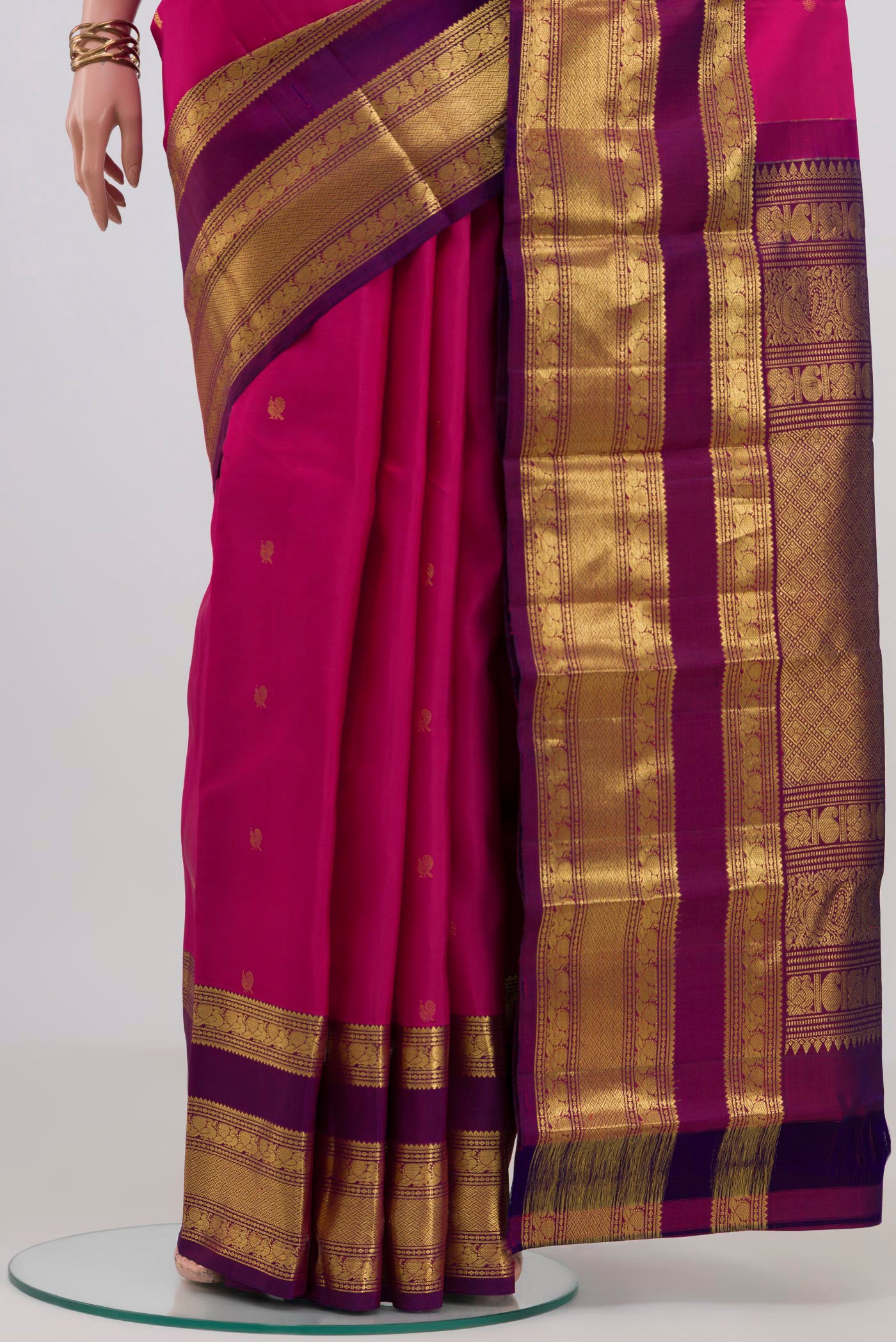 Pleats and pallu of Pink Kanchipuram Silk Saree with Zari Butta on the body and Zari Border. 
