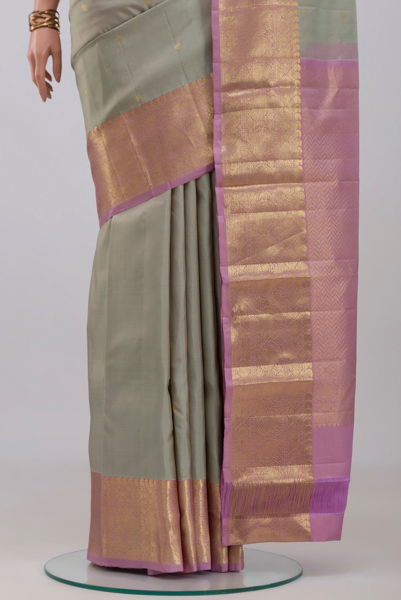 Pleats and pallu of Grey Kanchipuram Silk Saree with Zari Butta on the body and Zari Border. 