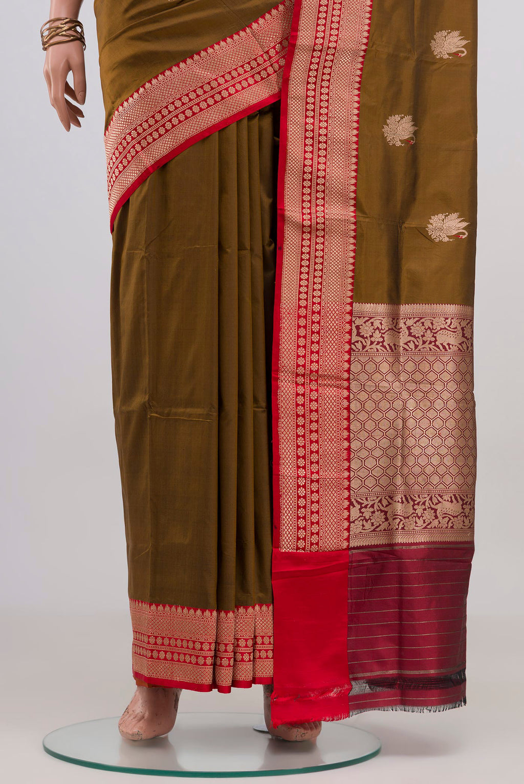 Pleats and pallu of Mehandi Green Banarasi Katan Silk Saree with Zari Butta on the body and Zari Border. 