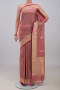 Rose Gold Banarasi Katan Silk Saree with Zari Butta on the body and Zari Border.  displayed on a mannequin