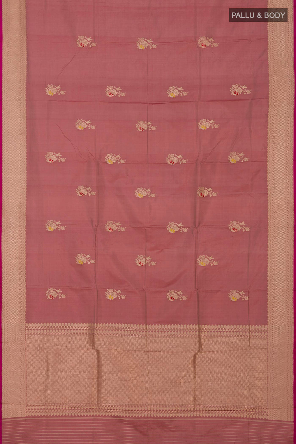 Flat view of Rose Gold Banarasi Katan Silk Saree with Zari Butta on the body and Zari Border. 
