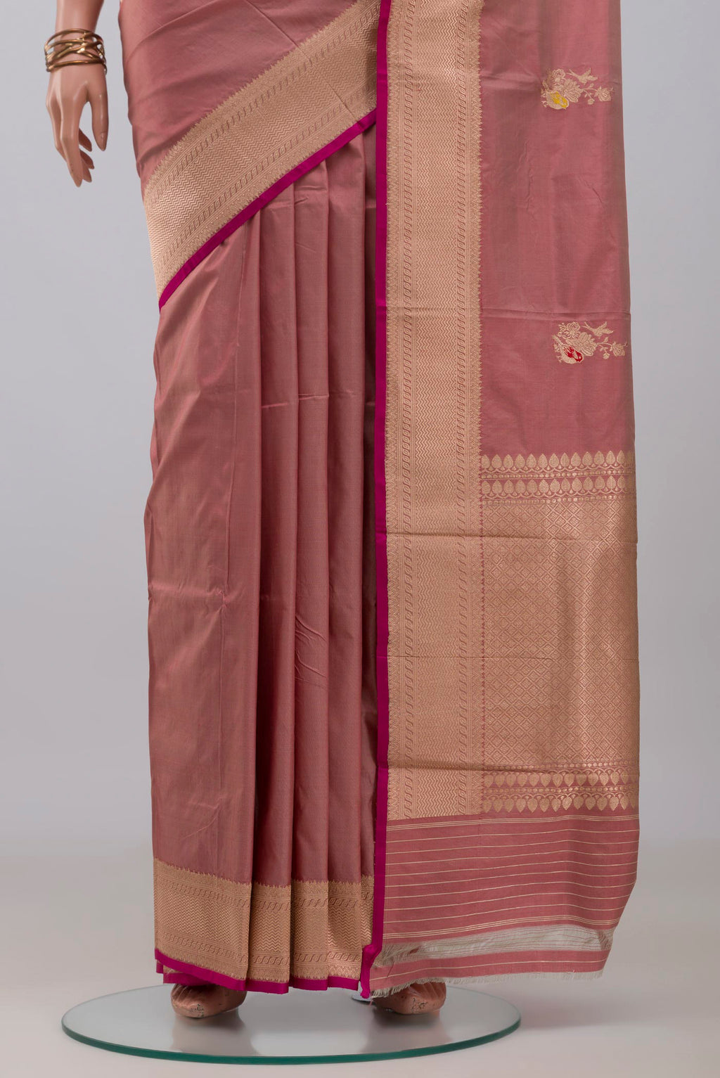 Pleats and pallu of Rose Gold Banarasi Katan Silk Saree with Zari Butta on the body and Zari Border. 