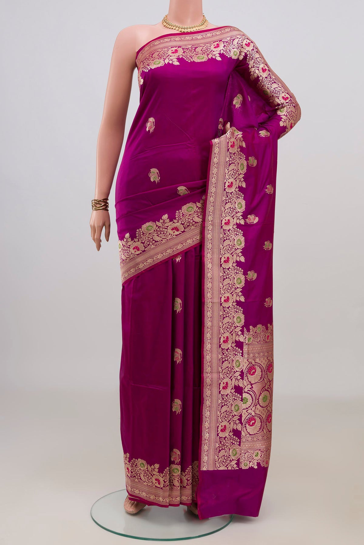 Pure Silk Magenta Banarasi Katan Saree with Zari Butta on the body and Fancy Border.  displayed on a mannequin
