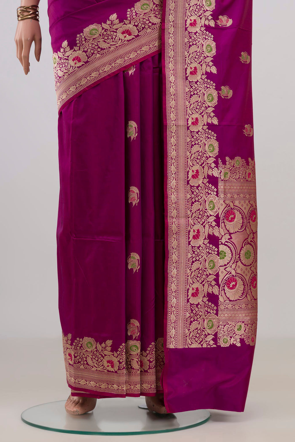 Pleats and pallu of Pure Silk Magenta Banarasi Katan Saree with Zari Butta on the body and Fancy Border. 
