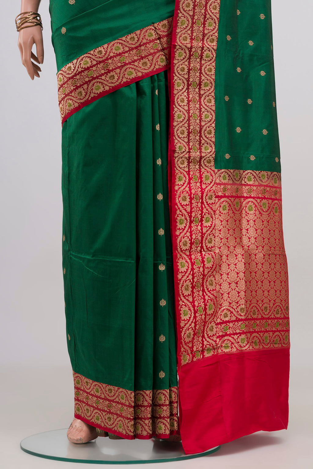 Pleats and pallu of Green Banarasi Katan Silk Saree with Zari Butta on the body and Zari Border. 