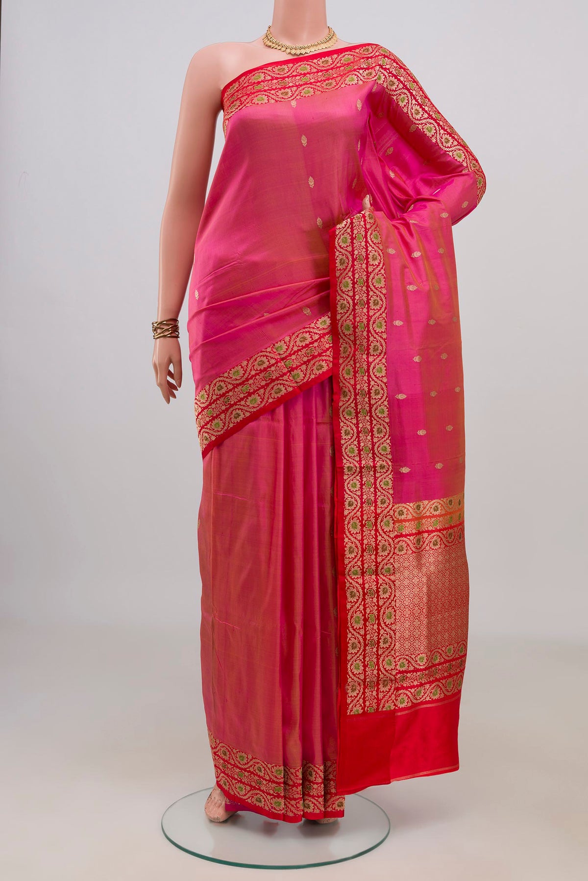 Pure Silk Pink Banarasi Katan Saree with Zari Butta on the body and Fancy Border.  displayed on a mannequin