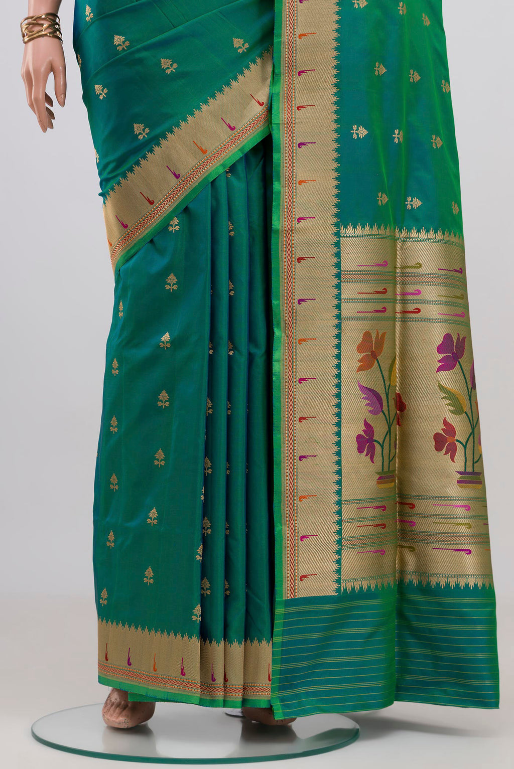 Pleats and pallu of Peacock Blue Banarasi Silk Saree with Zari Butta on the body and Zari Border. 