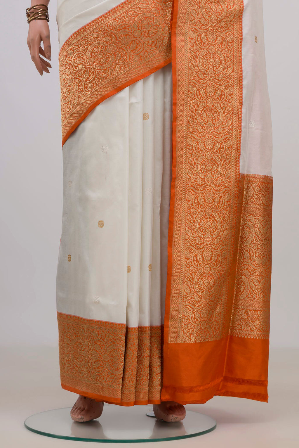 Pleats and pallu of Pure Silk White Banarasi Saree with Zari Butta on the body and Fancy Border. 