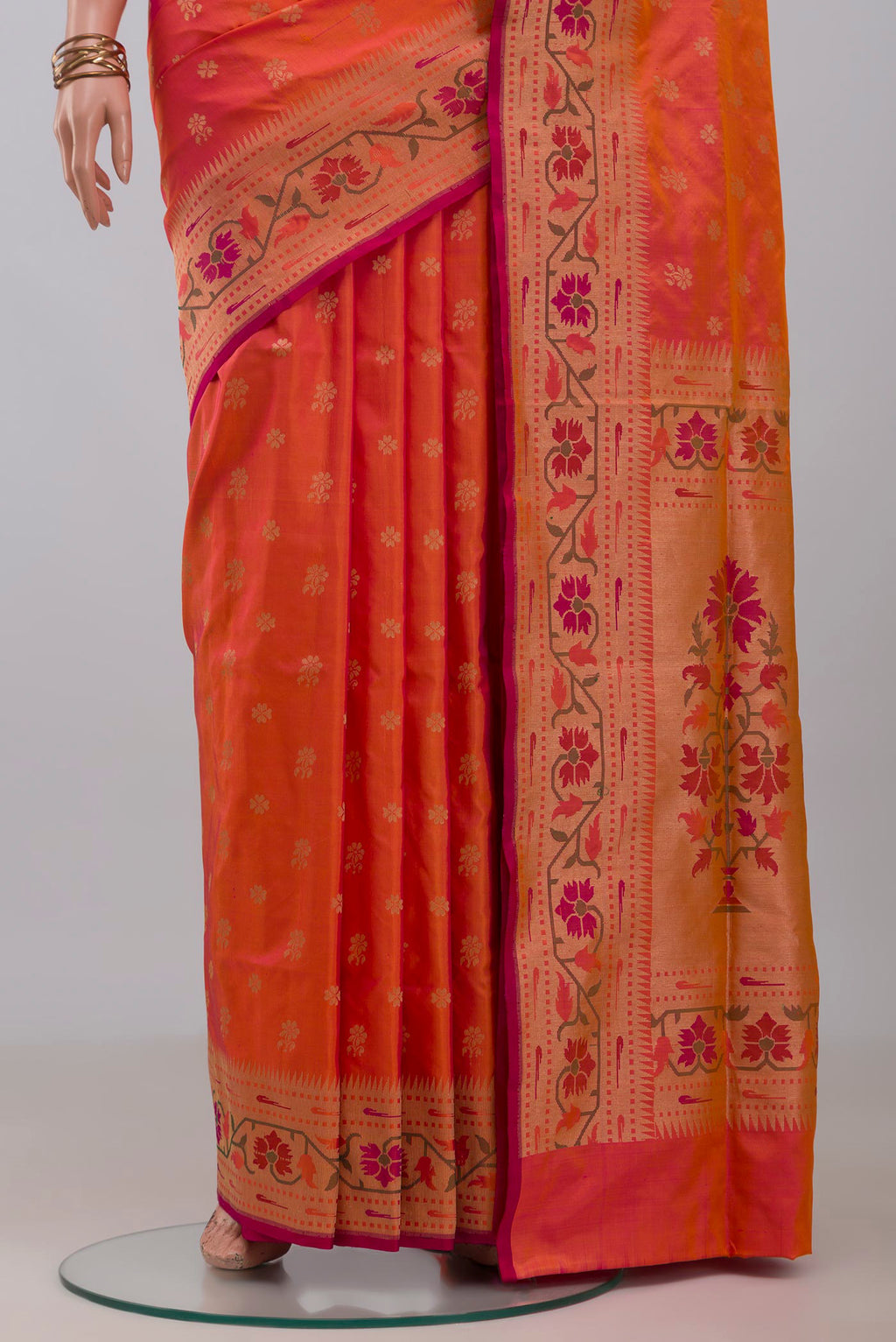 Pleats and pallu of Pinkish Yellow Dual Tone Banarasi Silk Saree with Zari Butta on the body and Zari Border. 