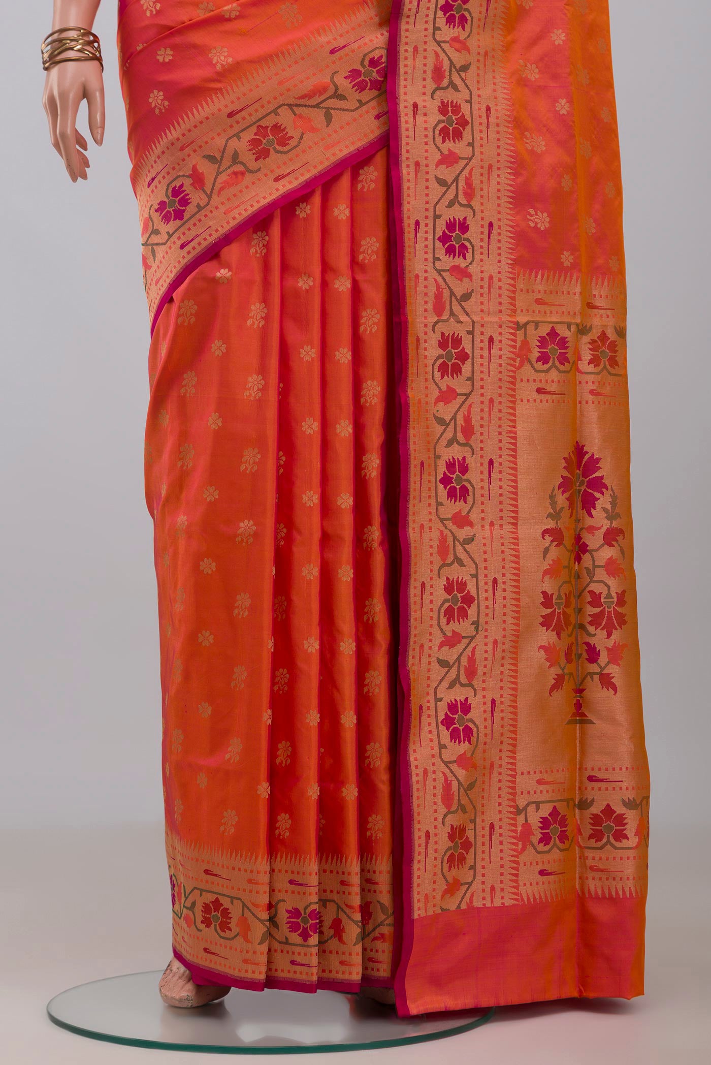 Pleats and pallu of Pinkish Yellow Dual Tone Banarasi Silk Saree with Zari Butta on the body and Zari Border. 