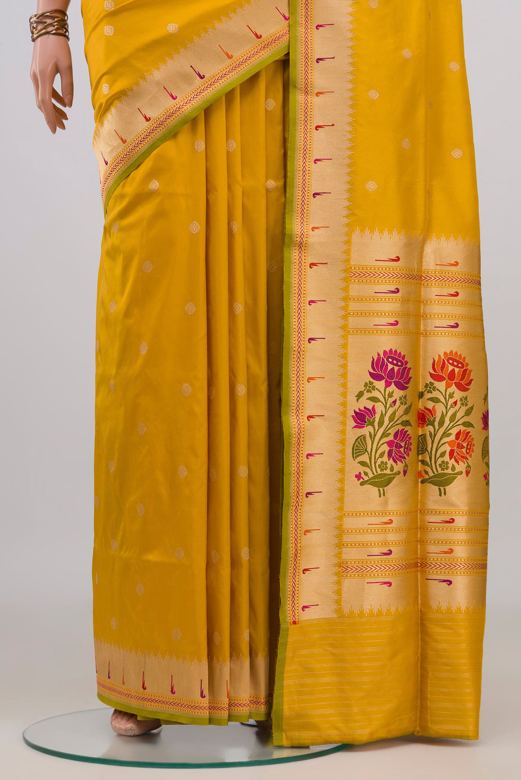 Pleats and pallu of Pure Silk Yellow Banarasi Saree with Zari Butta on the body and Fancy Border. 