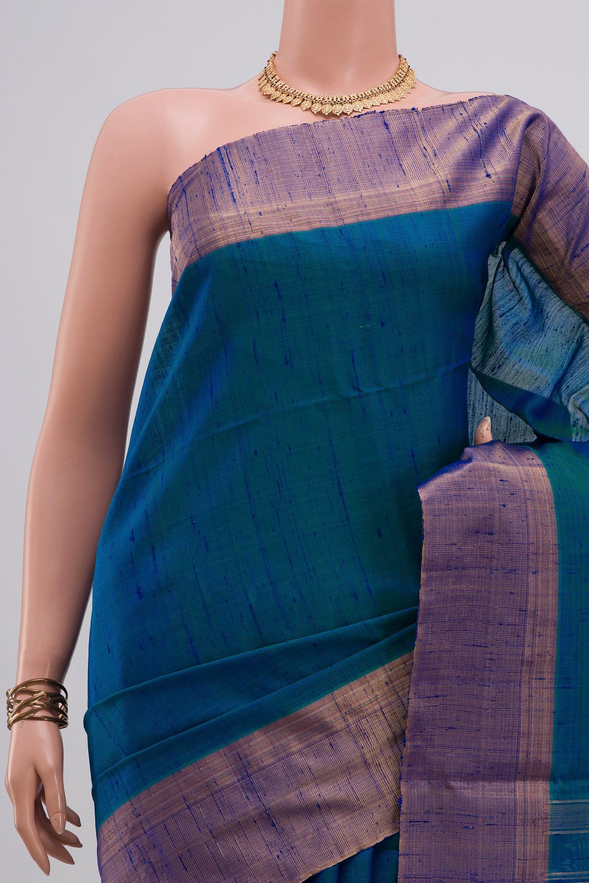 Border image of Pure Silk Peacock Blue Soft Saree with Plain Body and Zari Border. 
