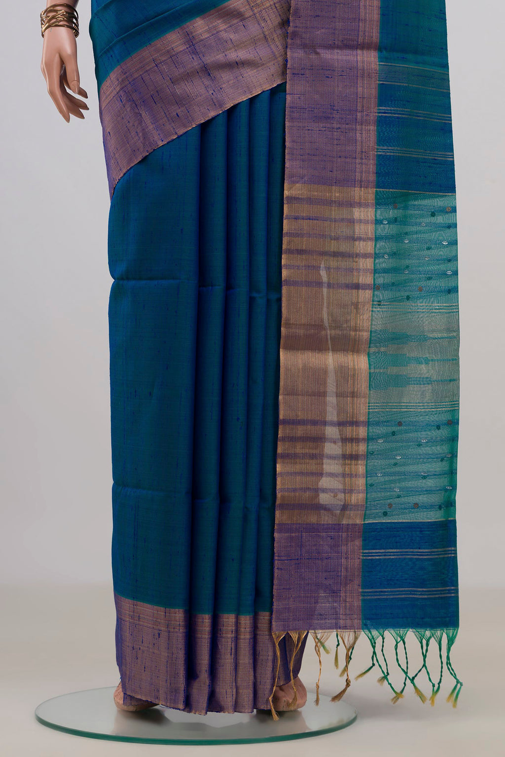 Pleats and pallu of Pure Silk Peacock Blue Soft Saree with Plain Body and Zari Border. 
