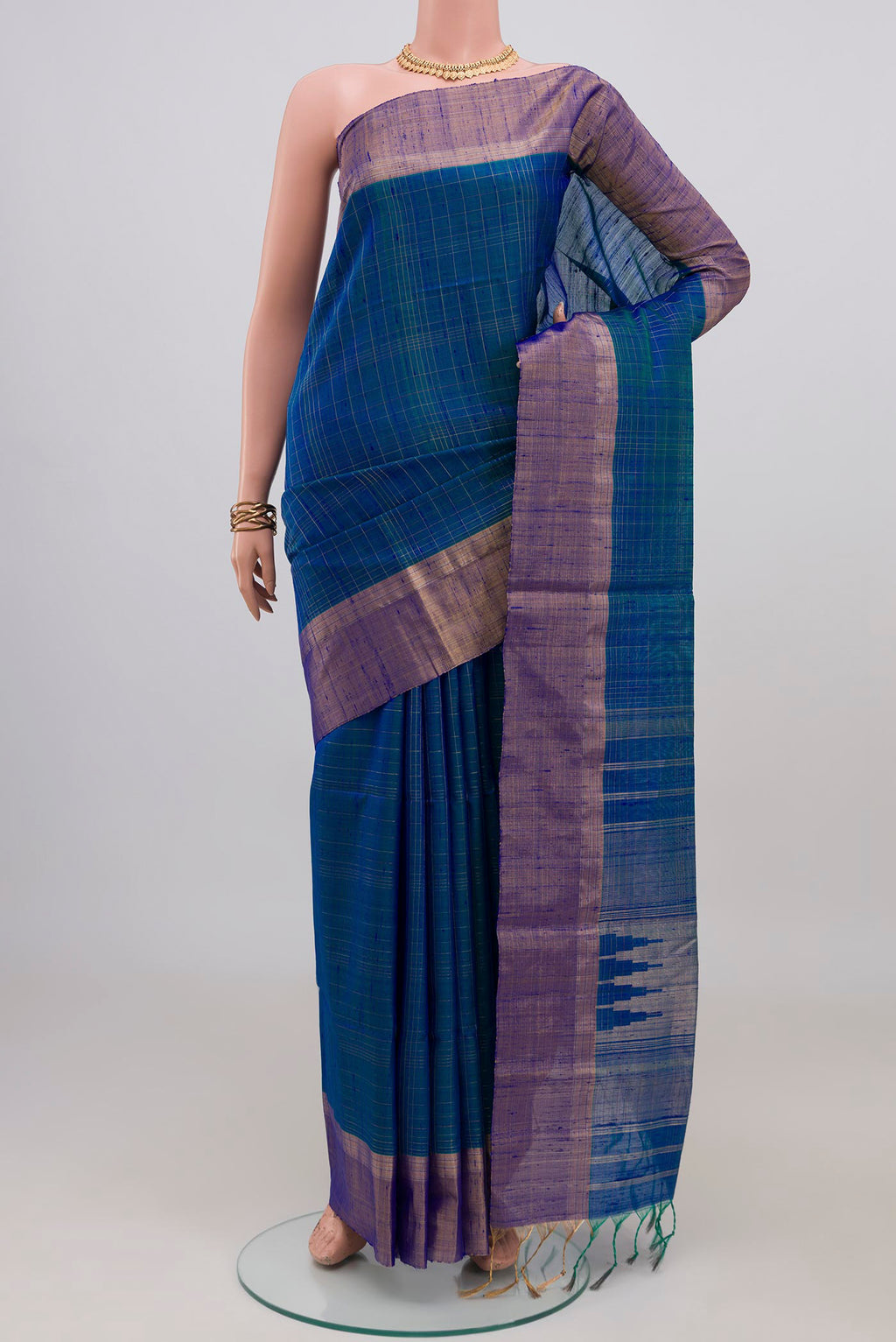 Blue Raw Silk Saree with Checked design on the body and Zari Border.  displayed on a mannequin