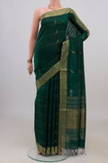 Pure Silk Bottle Green Raw Saree with Stripes on the body and Zari Border.  displayed on a mannequin