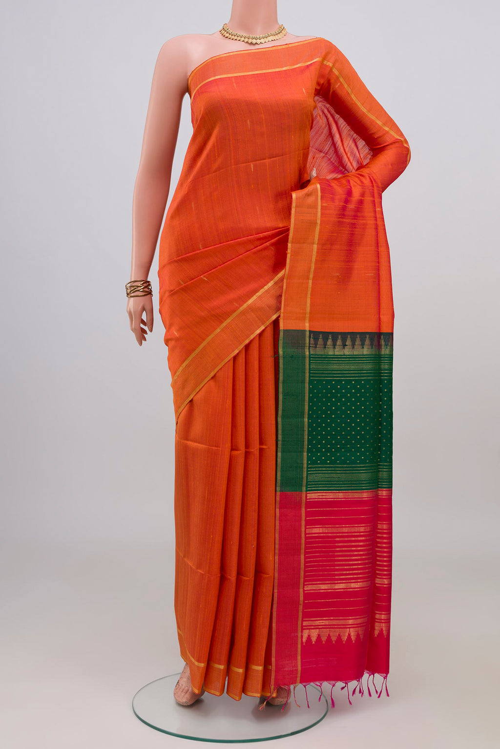 Orange Banarasi Raw Silk Saree with Plain Body and Zari Border.  displayed on a mannequin