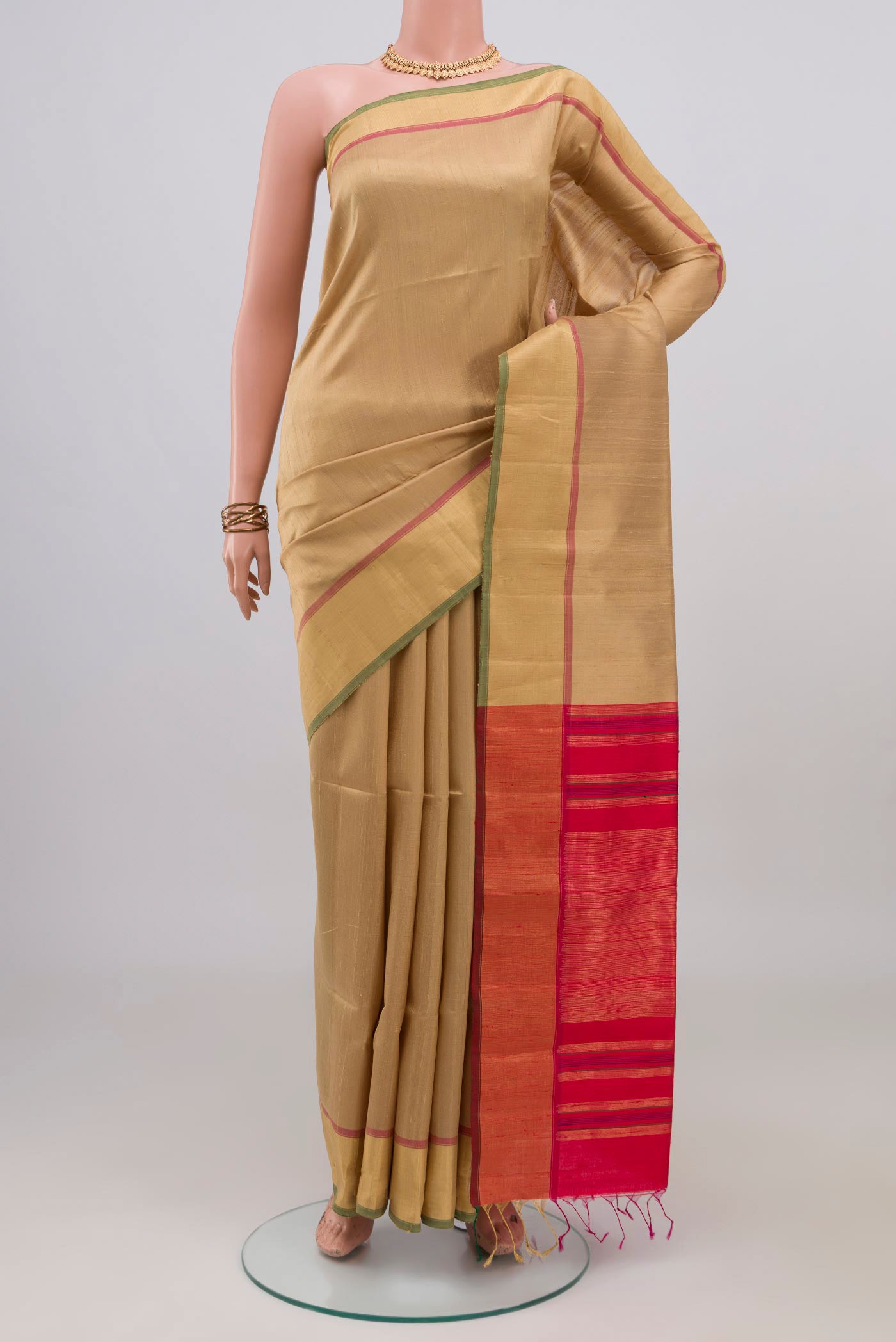 Beige Raw Silk Saree with Plain Body and Zari Border.  displayed on a mannequin