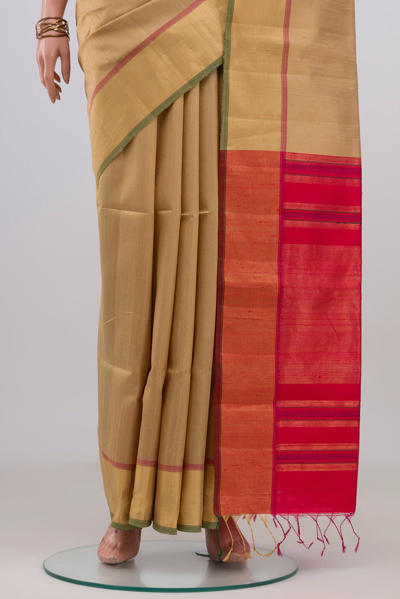 Pleats and pallu of Beige Raw Silk Saree with Plain Body and Zari Border. 