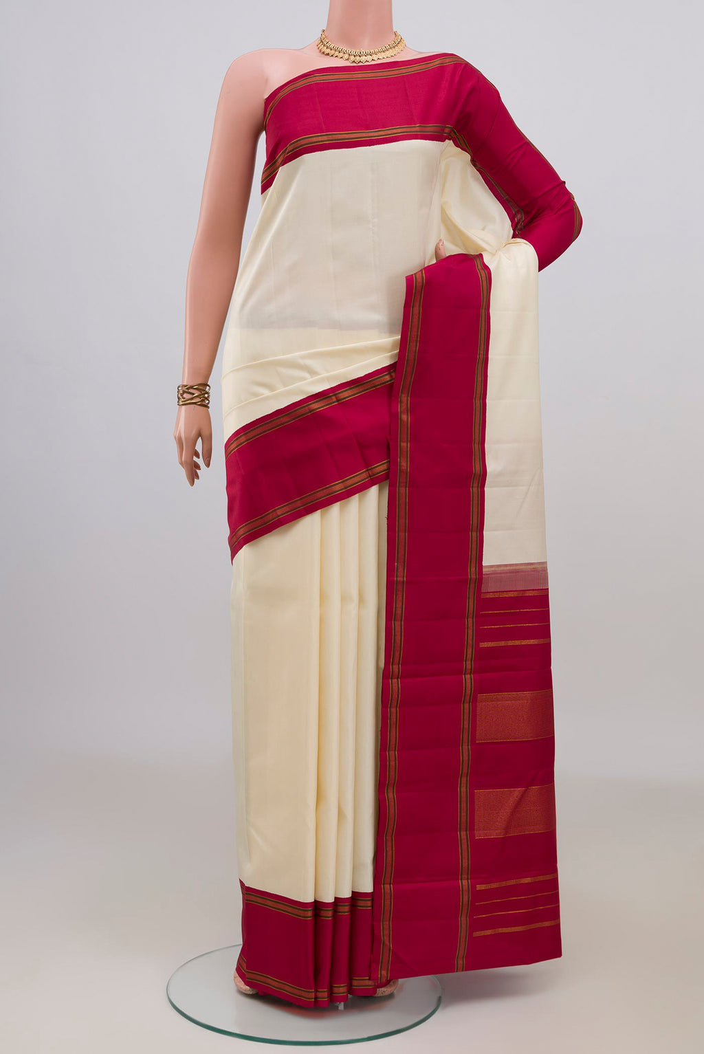 Pure Silk Cream Kanchipuram Saree with Plain Body and Plain Border.  displayed on a mannequin