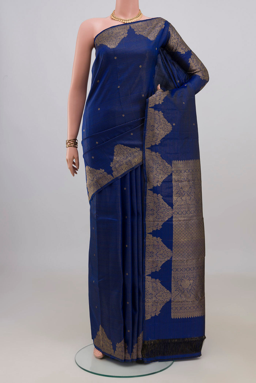 Pure Silk Blue Kanchipuram Saree with Zari Butta on the body and Fancy Border.  displayed on a mannequin