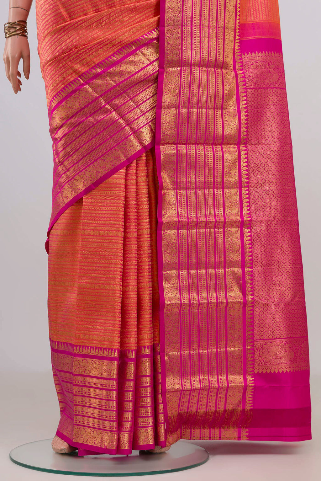 Pleats and pallu of Pure Silk Coral Kanjivaram Saree with Zari Brocade on the body and Zari Border. 