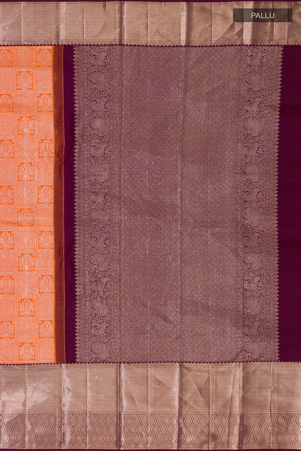 Close up image of the pallu of Orange Kanchipuram Silk Saree with Zari Brocade on the body and Zari Border. 