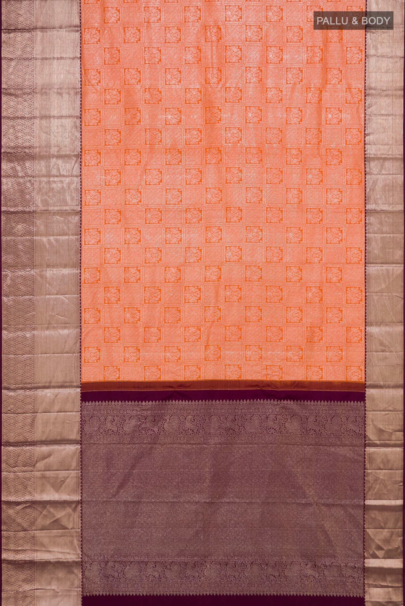 Flat view of Orange Kanchipuram Silk Saree with Zari Brocade on the body and Zari Border. 
