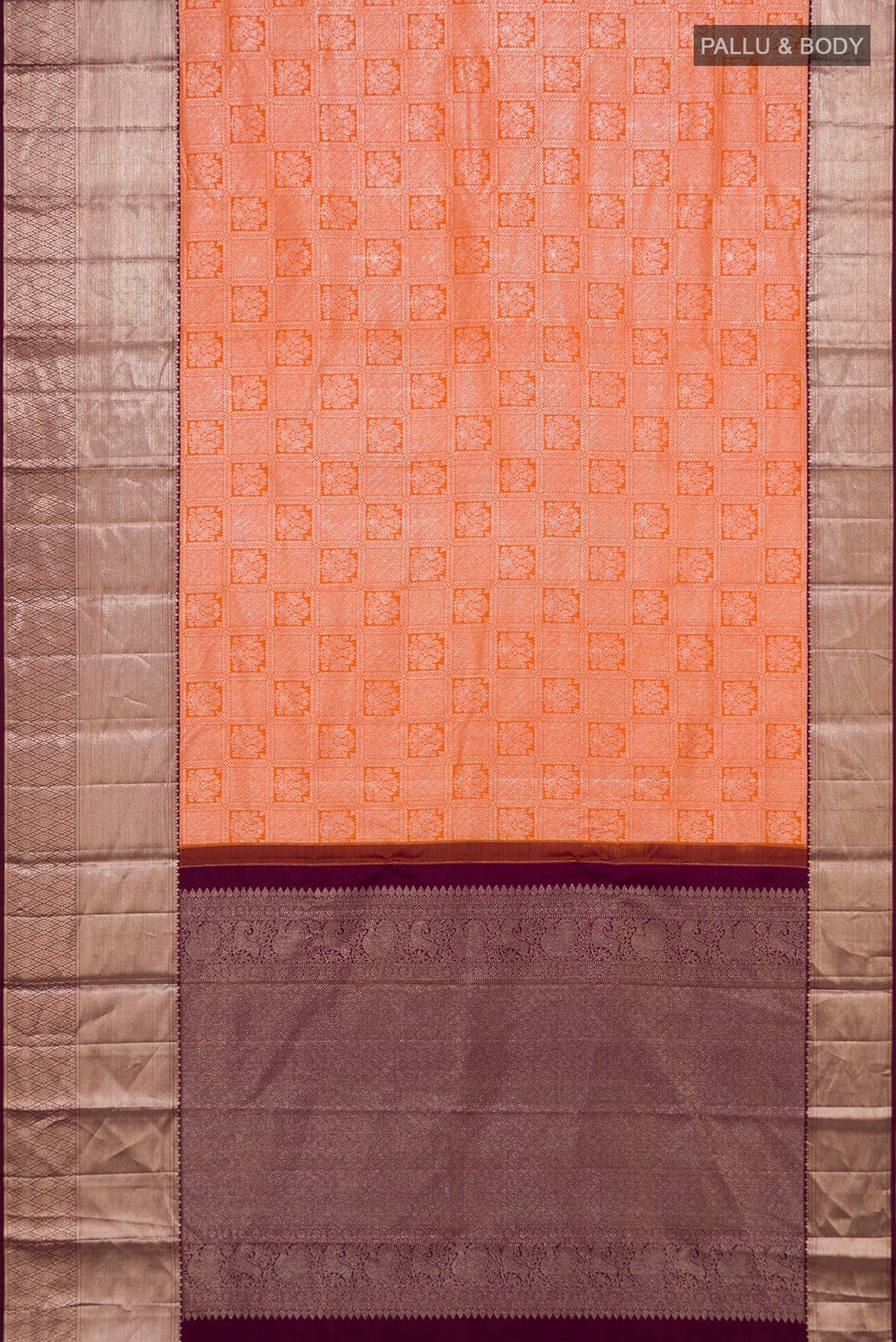 Flat view of Orange Kanchipuram Silk Saree with Zari Brocade on the body and Zari Border. 