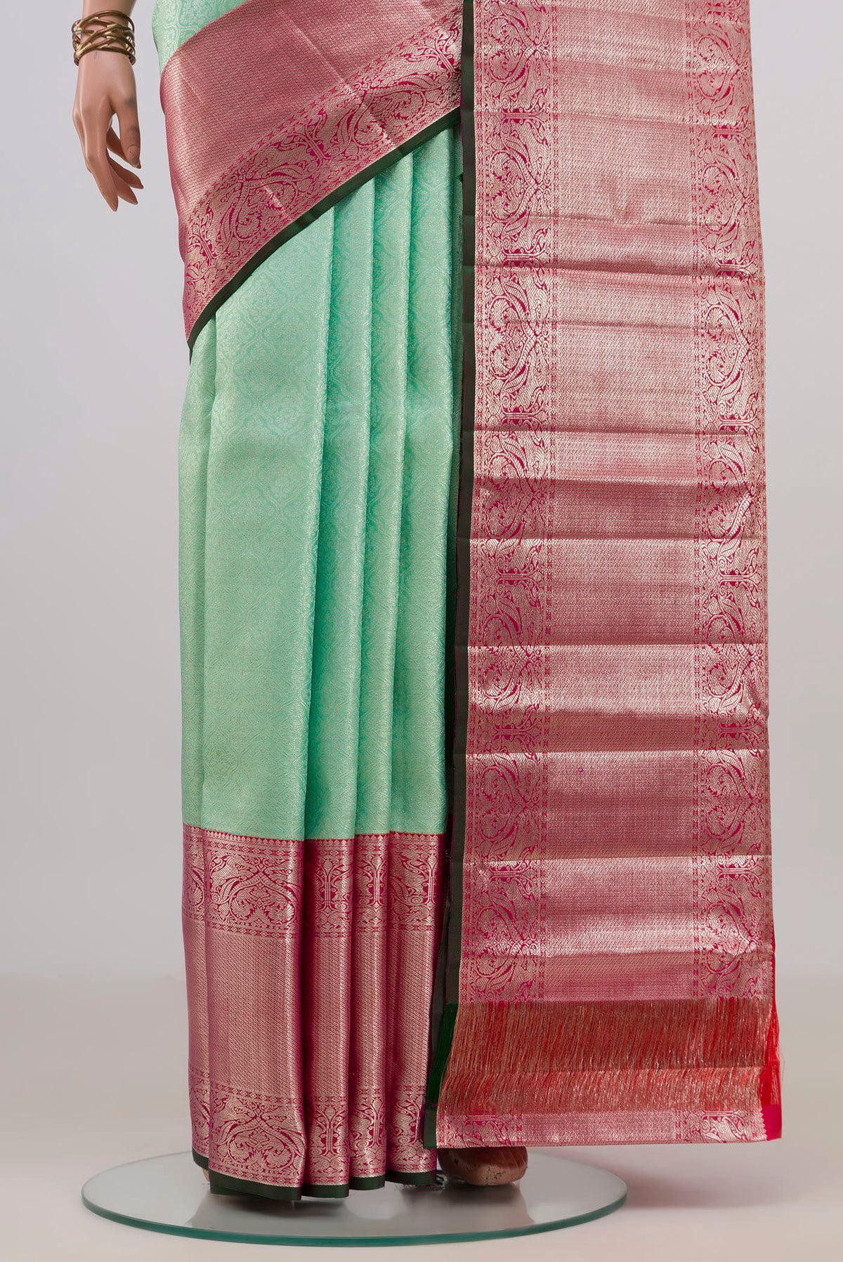 Pleats and pallu of Pure Silk Mint Green Kanchipuram Saree with Zari Brocade on the body and Zari Border. 