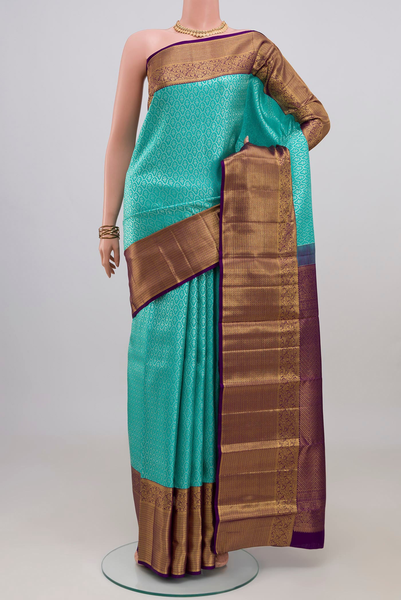 Light Blue Kanchipuram Silk Saree with Zari Brocade on the body and Zari Border.  displayed on a mannequin
