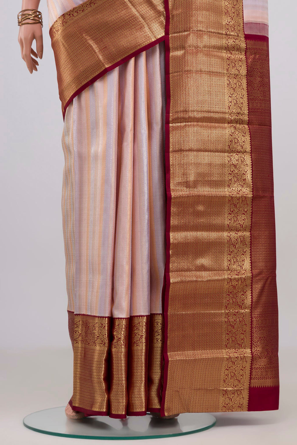 Pleats and pallu of Rose Gold Kanchipuram Silk Saree with Zari Brocade on the body and Zari Border. 