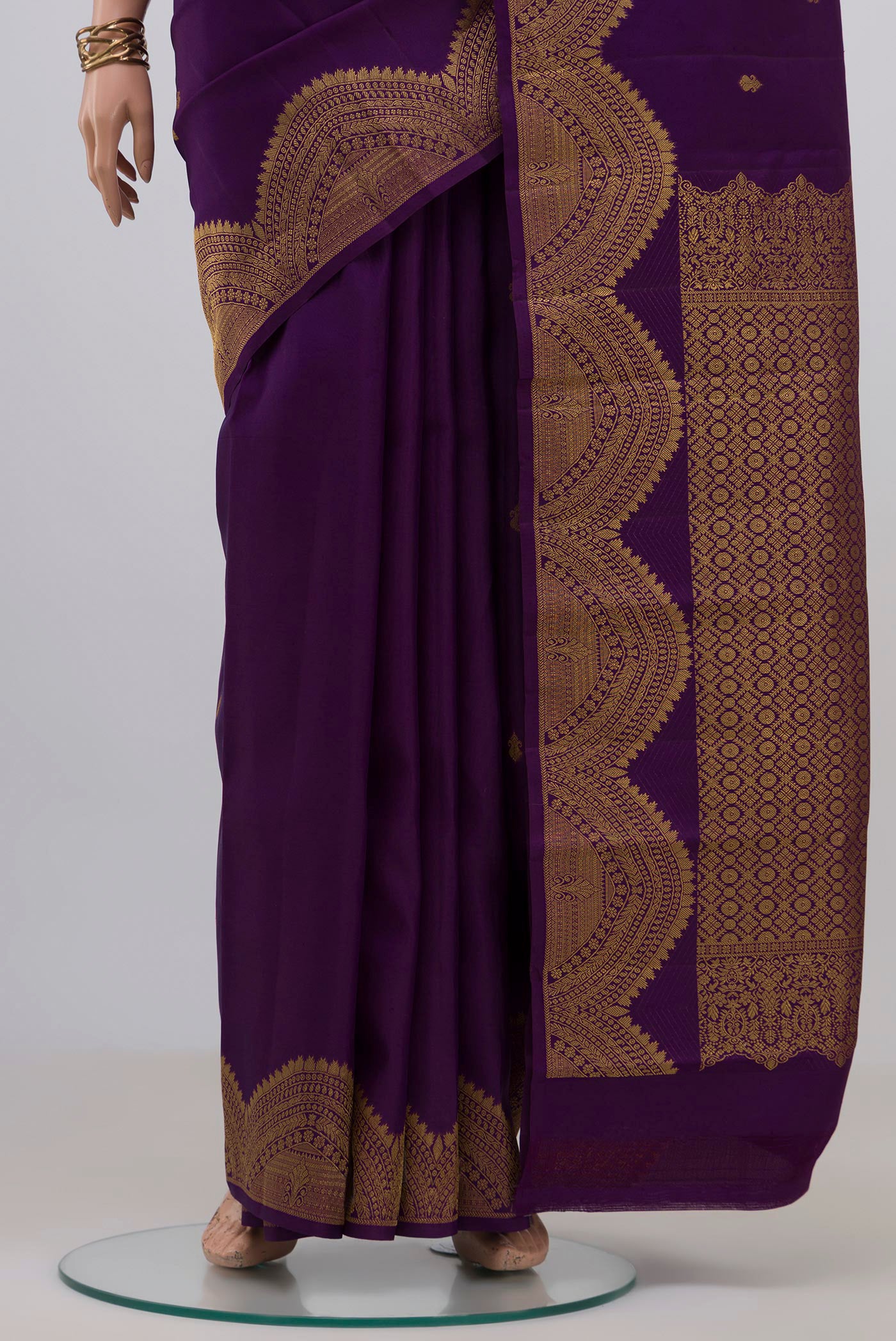 Pleats and pallu of Violet Kanchipuram Silk Saree with Zari Butta on the body and Fancy Border. 
