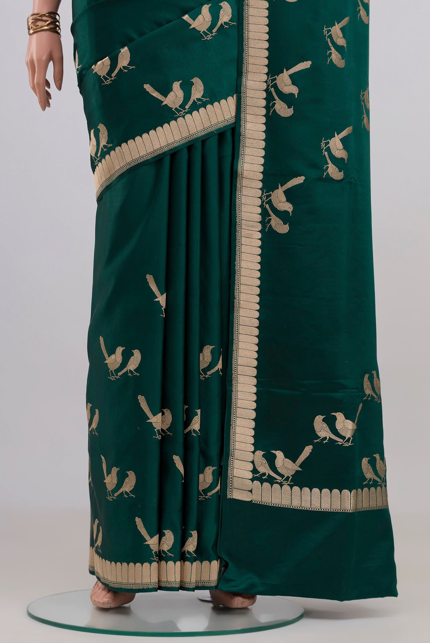 Pleats and pallu of Bottle Green Banarasi Silk Saree with Plain Body and Fancy Border. 