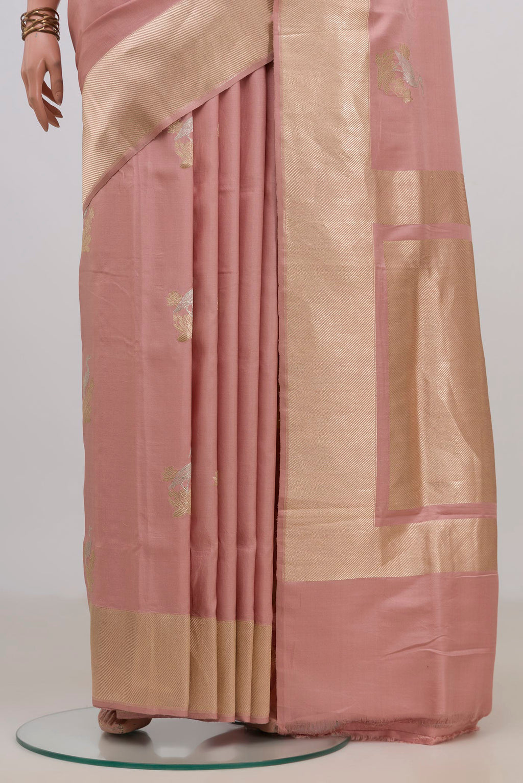 Pleats and pallu of Pure Silk Peach Banarasi Saree with Zari Butta on the body and Fancy Border. 