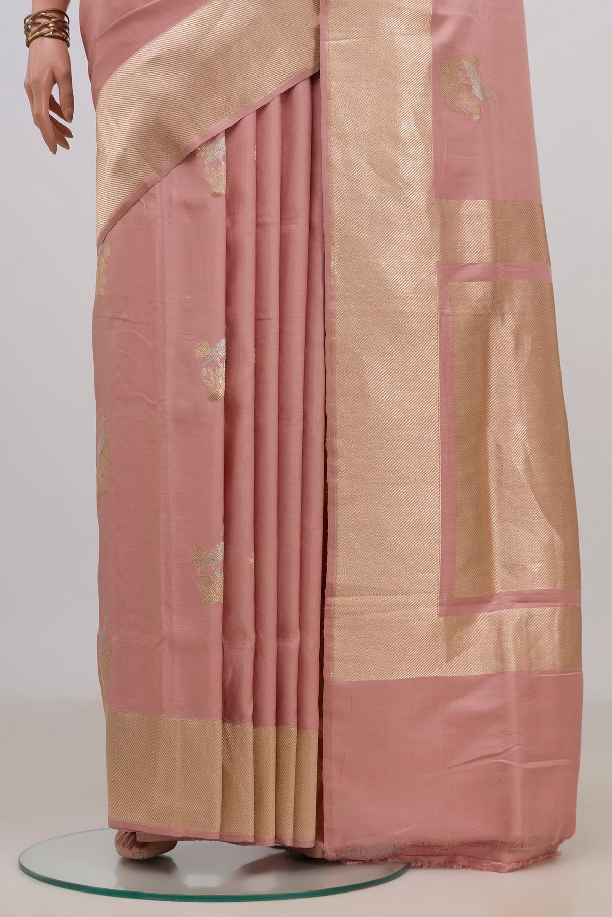Pleats and pallu of Pure Silk Peach Banarasi Saree with Zari Butta on the body and Fancy Border. 