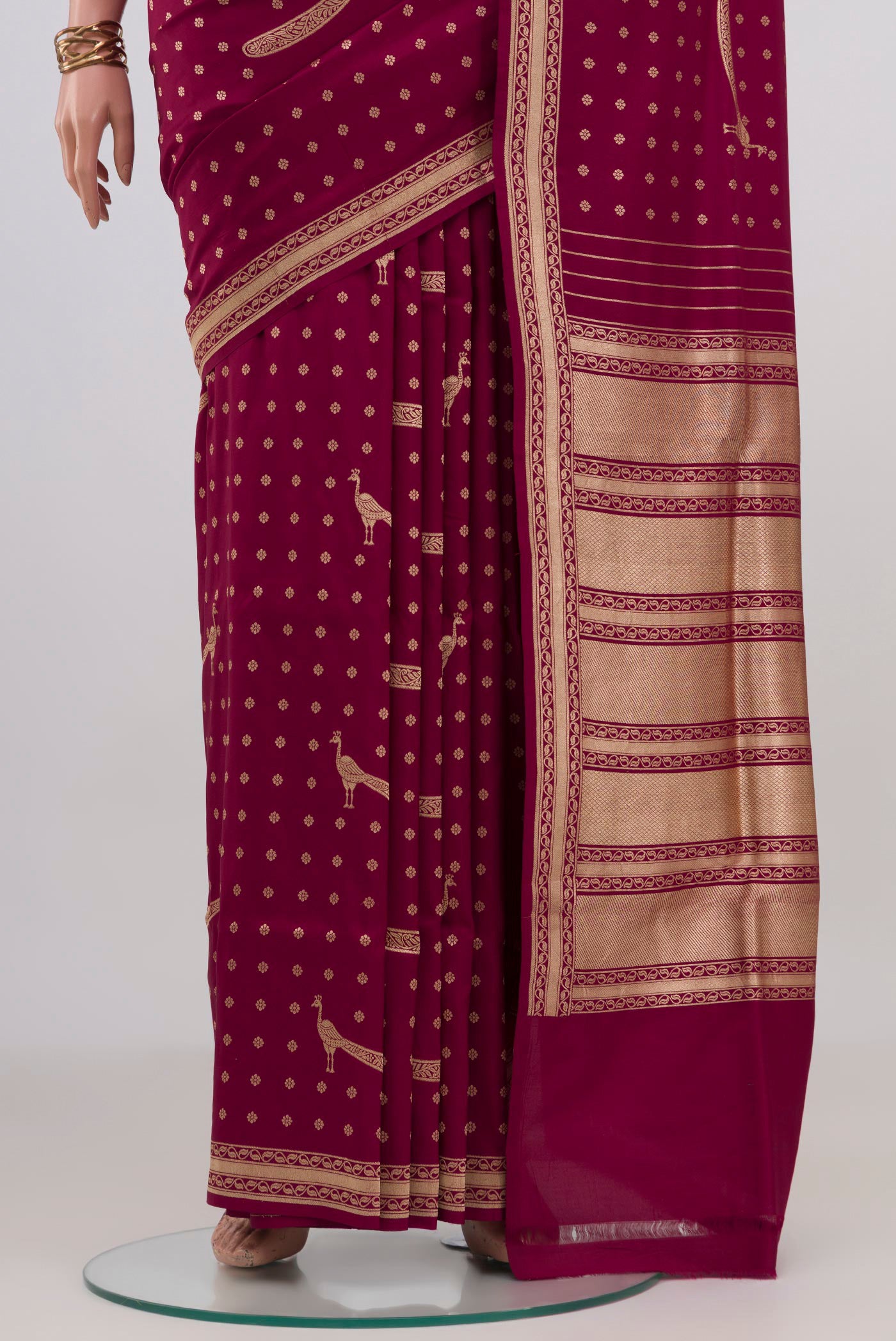Pleats and pallu of Maroon Banarasi Silk Saree with Zari Butta on the body and Fancy Border. 