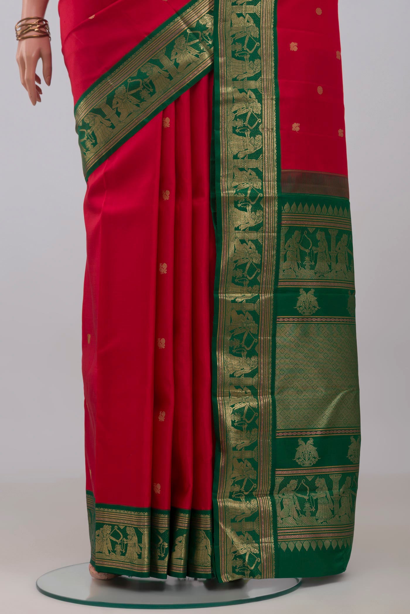 Pleats and pallu of Red Kanjivaram Silk Saree with Zari Butta on the body and Zari Border. 