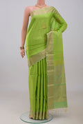 Light Green Soft Silk Saree with Zari Butta on the body and Zari Border.  displayed on a mannequin